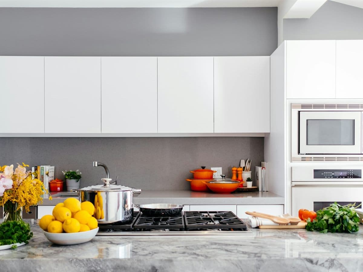 A kitchen with a white oven above a black stovetop.